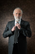 a man fixes the tie