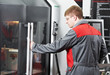 Photo: laborer working with machine tool laborer working with machine tool