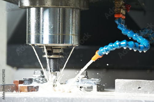 Photo: milling the metal blank with coolant milling the metal blank with coolant