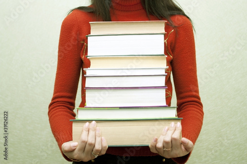 Photo: The woman with books in hands The woman with books in hands