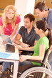 Woman in wheelchair attending group meeting