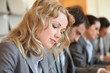 Young business people signing application form