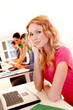 Beautiful blond girl working on laptop computer