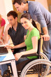 Woman in wheelchair attending group meeting