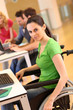 Young woman in wheelchair working in office