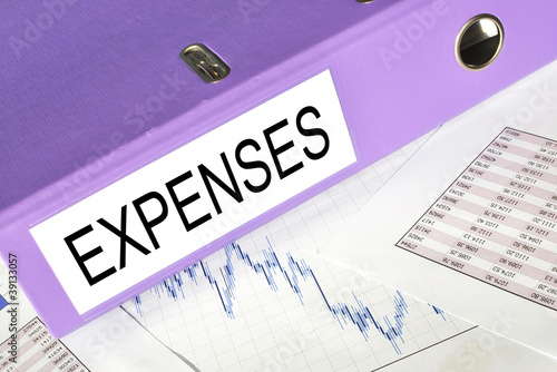 Photo: Expenses folder on a market report Expenses folder on a market report