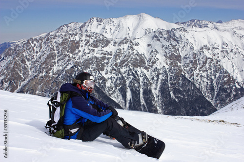 Photo: Snowboarder relaxing Snowboarder relaxing