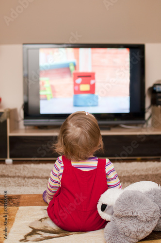 Photo: child watches television child watches television