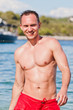 Handsome young man swimming