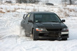 Photo: Black car on snowy road Black car on snowy road