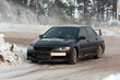 Photo: Black car on snowy road Black car on snowy road