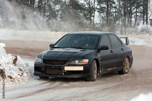 Photo: Black car on snowy road Black car on snowy road