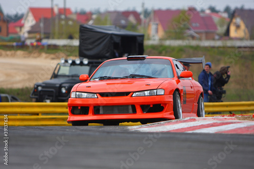 Photo: red car on the track red car on the track