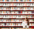 Foto: Young student in a library Young student in a library