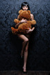 Photo: Beautiful naked girl is holding the teddy bear Beautiful naked girl is holding the teddy bear