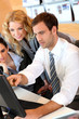 Business meeting in front of desktop computer