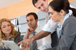 Business meeting in office with electronic tablet