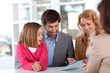 Family signing real-estate contract Family signing real-estate contract