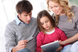 Photo: Family doing online shopping with tablet Family doing online shopping with tablet