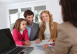 Photo: Family signing real-estate contract Family signing real-estate contract
