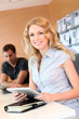 Beautiful office worker using tablet in office