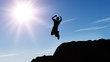 Photo: Silhouette of the jumping man from a rock Silhouette of the jumping man from a rock