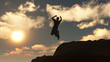 Silhouette of the jumping man from a rock Silhouette of the jumping man from a rock
