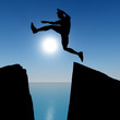 Photo: Silhouette of the jumping man from a rock Silhouette of the jumping man from a rock