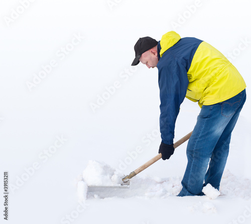 Photo: Man digging a path from the snow Man digging a path from the snow