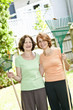 Women with rakes in garden