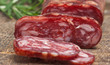 salami on wooden background close up salami on wooden background close up