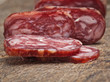 salami on wooden background close up salami on wooden background close up