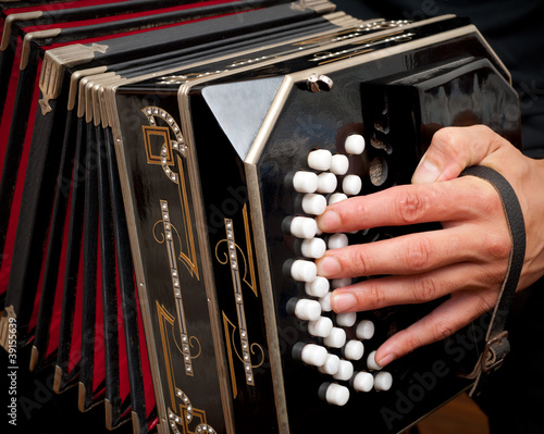 Photo: Playing traditional bandoneon. Playing traditional bandoneon.