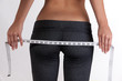 Photo: sexy woman measuring butt and thighs sexy woman measuring butt and thighs