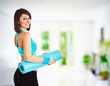 Fit woman with a gym mat