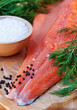 fresh salmon filet with ingredients : salt, dill, black pepper. fresh salmon filet with ingredients : salt, dill, black pepper.