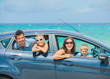 Foto: A family of four driving in a car A family of four driving in a car