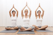 Interracial Group of Three Beautiful Women In Yoga Position