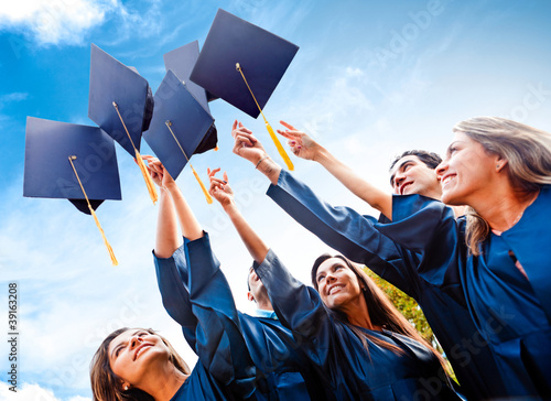 Photo: Students throwing graduation hats Students throwing graduation hats