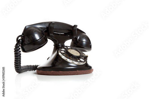 Photo: A black vintage telephone on white A black vintage telephone on white