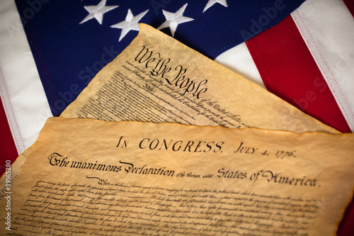 Photo: US Constitution and Declaration of Independence On flag US Constitution and Declaration of Independence On flag
