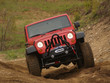 JEEP rouge 4x4, dans le sable