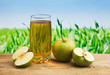 Apple juice in a glass on a table