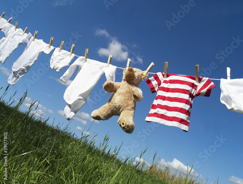 Photo: Baby clothing on a clothesline Baby clothing on a clothesline
