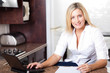 beautiful young blonde woman working from home