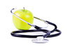 Photo: Green, ripe apple and stethoscope. Green, ripe apple and stethoscope.