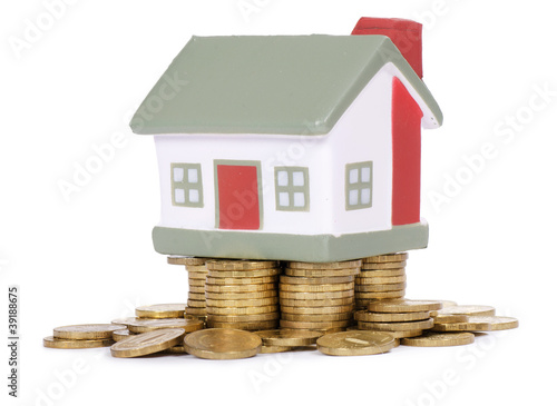 Photo: Toy small house and coins Toy small house and coins