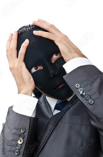 Photo: Industrial espionage concept with masked businessman Industrial espionage concept with masked businessman