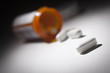 Foto: Medicine Bottle and Pills Under Spot Light Medicine Bottle and Pills Under Spot Light