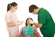 Dentist  and nurse working with patient